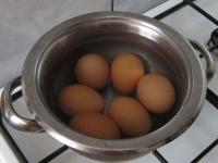 Cook hard boiled eggs, allow them to cool and peel...