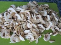 Wash the mushrooms and cut them into slices....