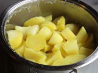 Brush potatoes, cut into a smaller cubes and put...