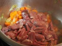 Cut the chicken hearts and add to the pot. Stir...