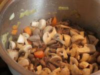 Add the mushrooms cutted into quarters and simmer...