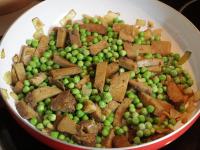 Add frozen peas, a little water and simmer for...