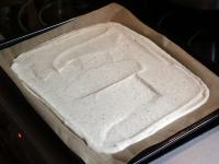 Pour the dough into a baking tin (30x40 cm) lined...