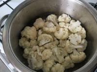 Divide the cauliflower into smaller florets, wash...