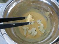 Dip cauliflower florets in the batter......