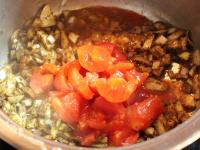 Add sterilized tomatoes, cutted into smaller...