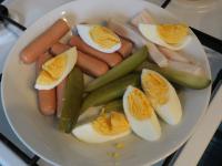 Cook two hard-boiled eggs, peel and cut into...