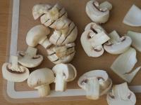 Wash the mushrooms and cut them into slices....