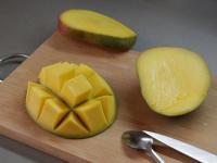 Peel a larger ripe mango and cut the sweet flesh...