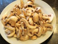 Wash the mushrooms and cut them into slices....