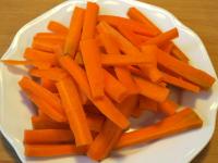 Clean the carrots, wash them and cut them into...