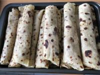 Place the wraped lokše in a baking sheet and warm...