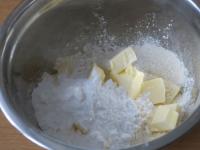 Add sugar and chopped butter to the flour....