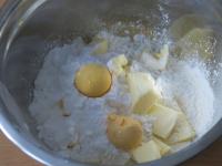 Add two boiled yolks, one raw egg yolk and a pinch...