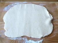 Knead dough which you roll on a floured board to a...