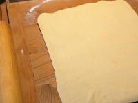 Roll the dough on a floured board to a thickness...