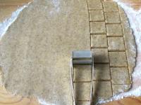 Roll the dough on a with sugar sprinkled board to...