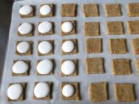 Put small amount of whipped egg whites on the...