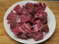 Wash the meat and cut it into cubes....