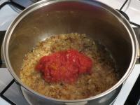 Add tomatoes to the caramelized onion and cook for...