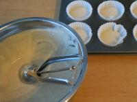 Put paper liners in the muffin mould. Put one...