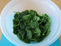 Wash the spinach and cut into thin strips....