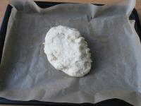 Roll out the dough on baking paper and put in a...