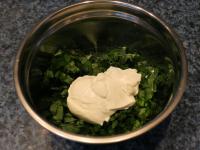 Add cream and mix well by pressing garlic against...