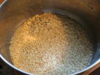 Add oat flakes into the pot and add water. Bring...