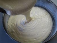 Grease the cake mold with butter and sprinkle with...