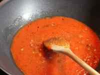 Add tomato puree, season and continue cooking....