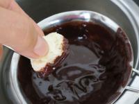 Dip the bottom of the coconuts confection in...