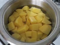 Brush potatoes, cut into a smaller cubes and put...