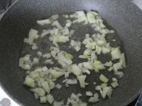 Peel an onion, chop finely and cook in oil....