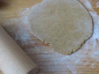 Roll the dough on a floured board to a thickness...