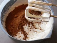 Prepare the cream by whipping the cream, add cocoa...