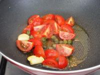 Add the tomatoes into the pan together with the...