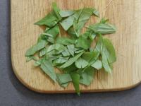 Cut a handful of fresh basil leaves. ...