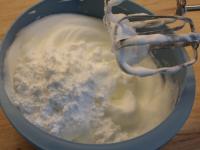 Whip solid egg whites snow and add sugar....