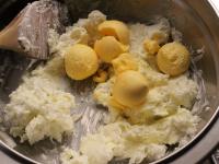 Remove the yolks from the boiled eggs and mix them...