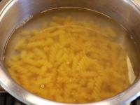 Cook the pasta in salted water and drain....