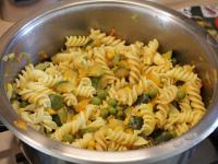 Mix the pasta with vegetables and sprinkle with...