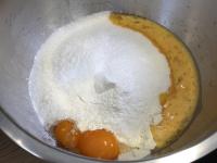 Put flour into a bowl, add baking powder, egg yolk...