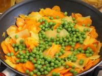 Add peas to the vegetables, stir and simmer for...