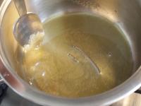 Cook caramel in a pot. Pour it on foil, sprinkle...