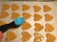 Put the shapes on a baking sheet lined with baking...