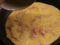 Pour the beaten eggs evenly over the prepared...