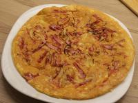 Turn omelet over on a plate with the tortilla...