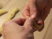 Roll smaller pieces of dough into the shape of a...